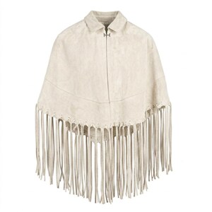 May include: A beige suede poncho featuring a classic collar, a single silver-toned metal hook-and-eye closure at the neckline, and a horizontal seam across the chest. The hem is finished with long, thin, matching beige suede fringe detailing.
