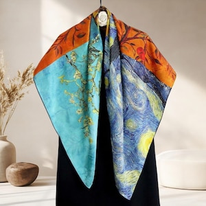 May include: Square silk scarf featuring artwork inspired by Van Gogh's paintings. The scarf displays a vibrant combination of colors, including blue, orange, and yellow. One section showcases a starry night scene, while another depicts blossoming almond branches.