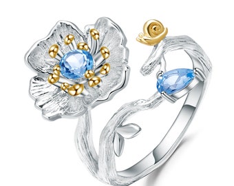 Flower Ring in Sterling Silver with a Natural Swiss-Blue Topaz and Gold Plated accents.