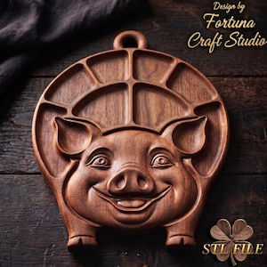 May include: A dark brown wooden serving tray shaped like a pig's head with a carved face and multiple recessed compartments for food. The top features a small hanging loop. Text at the top reads Design by Fortuna Craft Studio and STL FILE.