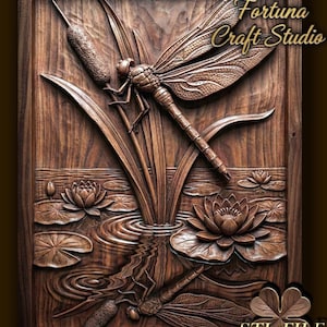 May include: A detailed wooden carving of a dragonfly perched on reeds above water lilies. The artwork features intricate details, including the dragonfly's wings and the water's ripples. The text "Design by Fortuna Craft Studio" is visible.