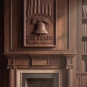 May include: A rectangular wooden wall plaque featuring a carved eagle, an American flag, and the Liberty Bell. The text reads FAITH FREEDOM INDEPENDENCE, 250 YEARS, and 1776-2026. The plaque is mounted above a fireplace with a dark wood mantel and columns.
