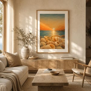 May include: A framed wall art print featuring a geometric illustration of a sunset over the ocean with a collection of tan and beige seashells in the foreground. The artwork displays warm orange and yellow sky tones above a blue sea.