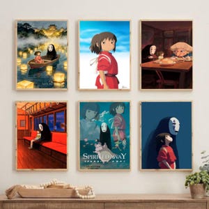 May include: Six framed art prints featuring scenes from the animated film "Spirited Away." The prints depict characters and settings from the movie, including a girl in a red outfit, the No-Face spirit, and various landscapes.