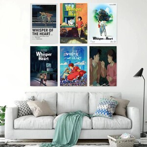 May include: Six framed movie posters from the animated film "Whisper of the Heart" are displayed on a white wall. The posters feature colorful illustrations of characters and scenes from the movie, with the title prominently displayed.