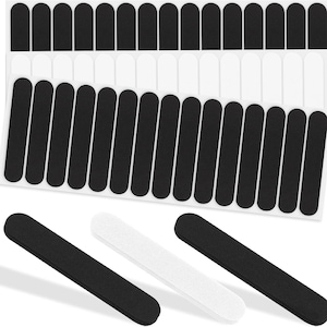 May include: A collection of black and white nail files. The image shows several sheets of black and white nail files, with some individual files displayed at the bottom. The files are rectangular with rounded ends.