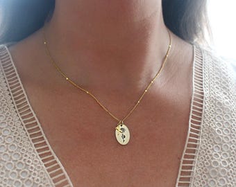 Collar de flores del mes de nacimiento dorado estrellado