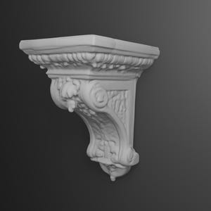 May include: A white, ornate wall bracket with a square top and decorative carvings. The bracket features a scrolled design and a detailed, textured surface. This architectural element is designed for supporting shelves or decorative items.