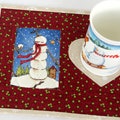 Quilted Snowman Mug Rug, Winter Snack Mat, 10"x8" product logo