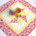 Quilted Table Topper, Pink Daisies, 18"x18" product logo