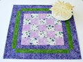 Quilted Table Topper, Purple Pansies, 16.75"x16.75" product logo