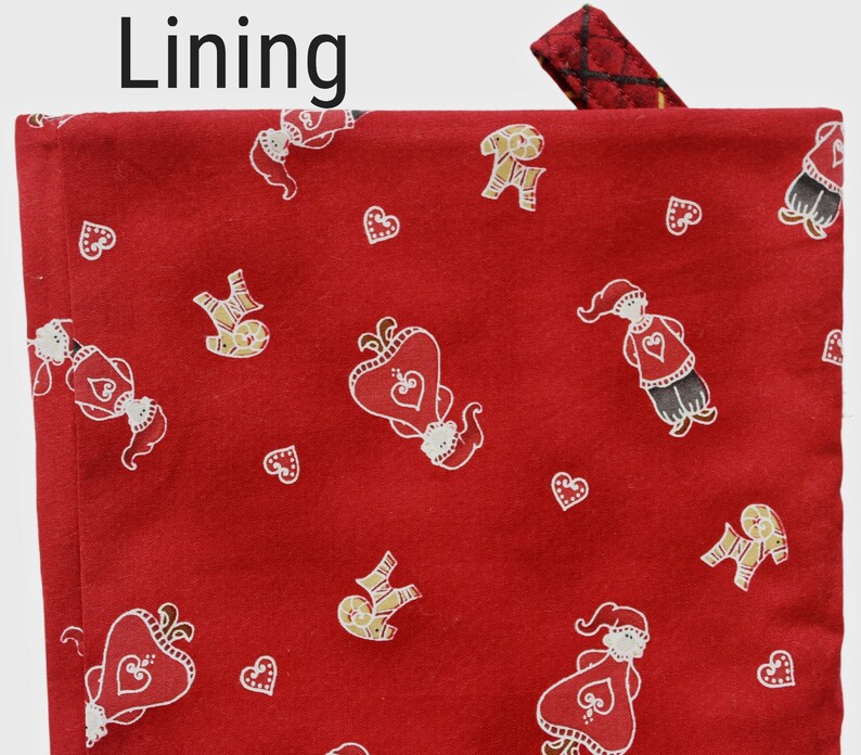 Layered with cotton batting and lined with Santa girls and boys, hearts on red.