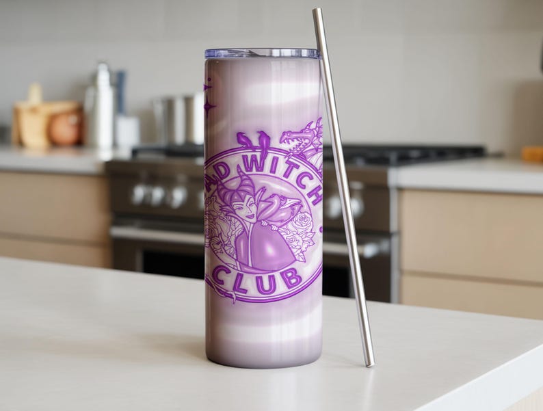 May include: A tall, purple tumbler with a stainless steel straw. The tumbler features a circular design with the words "BAD WITCH CLUB" and a graphic of a witch. The background has a gradient effect.