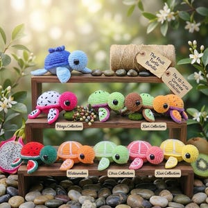 May include: A collection of ten crocheted turtle toys displayed on a three-tiered wooden stand. The turtles feature various fruit-inspired designs including watermelon, pitaya, kiwi, and citrus patterns. Each turtle has black eyes and yarn shells.