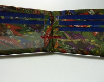 hand made duct tape wallet with the TMNT all over it