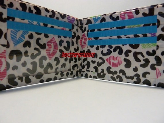 hand made duct tape wallet with colored lace deisgn on it
