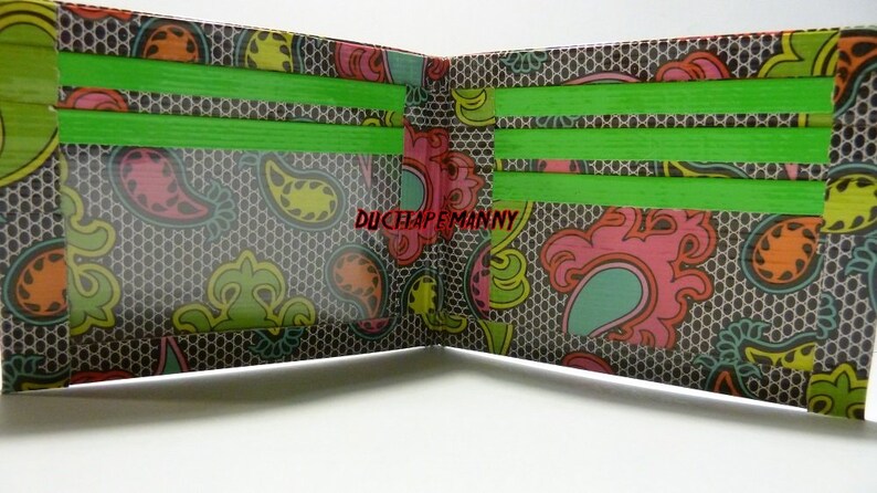 hand made duct tape wallet with colored lace deisgn on it