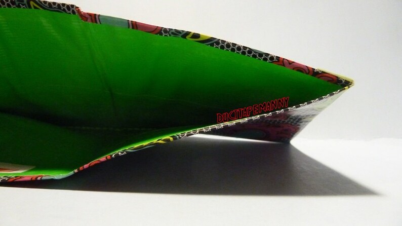hand made duct tape wallet with colored lace deisgn on it