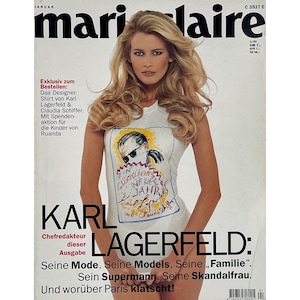 May include: The January 1995 cover of Marie Claire magazine features a woman wearing a white t-shirt with a graphic of Karl Lagerfeld. The magazine title is at the top, with the name "KARL LAGERFELD" prominently displayed below.