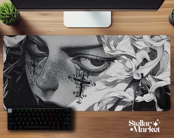 May include: Black and white mousepad featuring a detailed illustration of a face with cross tattoos and freckles. A black keyboard and mouse are visible. The Stellar Market logo is in the bottom right corner.