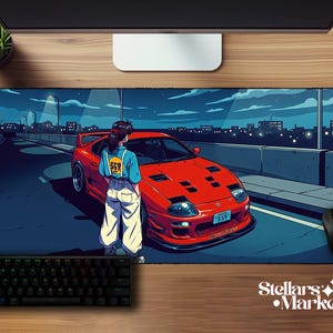 May include: A rectangular desk mat featuring an anime-style illustration of a person standing next to a bright red sports car on a bridge at night. The car has a license plate reading 559, and the person wears a blue shirt with a yellow 559 patch.