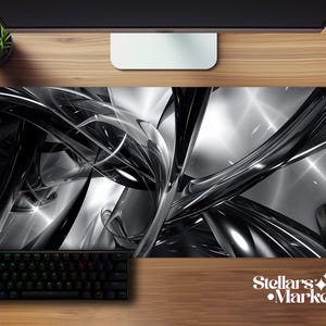 May include: A black and white abstract design mousepad with a keyboard and mouse. The mousepad features a flowing, glossy design with highlights and the text "Stellars Market". The keyboard has multi-colored keys.