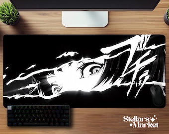 May include: Black and white anime-style mousepad featuring a close-up of a character's eye and hair. A black keyboard and mouse are visible. The mousepad has the text "Stellars Market".