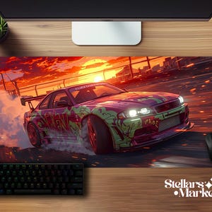 May include: A colourful mouse mat depicting a drifting sports car against a sunset. The car is decorated with purple and green graffiti art. A black keyboard and mouse are visible.