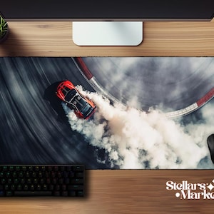May include: A rectangular mouse pad featuring a red sports car drifting on a racetrack, creating a cloud of white smoke. A black keyboard and mouse are also visible. The Stellar's Market logo is in the bottom right corner.