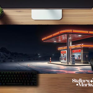 May include: Black rectangular desk mat featuring a nighttime gas station scene with neon lights and the text "DONUTS-TO-GO". A black keyboard and mouse are visible. The mat has the text "Stellars Market".