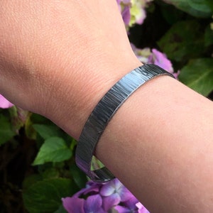 Sterling silver chunky bangle with beautiful hammered texture.