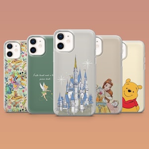 May include: A collection of clear phone cases featuring various Disney character designs. The cases showcase images of Winnie the Pooh, Belle, Tinkerbell, and Cinderella's castle. The cases are displayed against a neutral background.