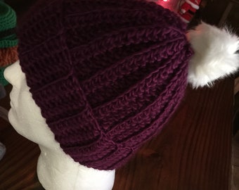 Crocheted hat with pompom