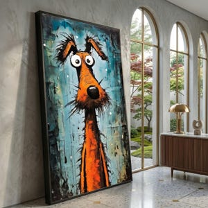 May include: Large framed artwork featuring a whimsical dog portrait. The dog has an orange body, large eyes, and a long snout. The background is a textured blue with white accents. The artwork is displayed in a modern interior setting.