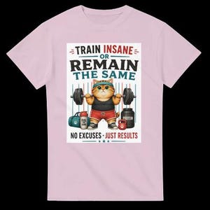 May include: A light pink t-shirt featuring a graphic of an orange tabby cat lifting a barbell. The cat wears a teal headband, black tank top, red shorts, and sneakers. Text reads: TRAIN INSANE OR REMAIN THE SAME, NO EXCUSES JUST RESULTS.