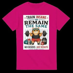 May include: A bright pink t-shirt featuring a graphic of an orange tabby cat lifting a barbell. The text reads: TRAIN INSANE OR REMAIN THE SAME and NO EXCUSES JUST RESULTS. The cat wears a headband, black tank top, red shorts, and sneakers.