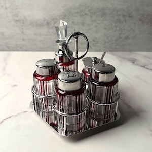 Juego de vinagreras eduardiano - Vidrio rubí y transparente con soporte giratorio cromado