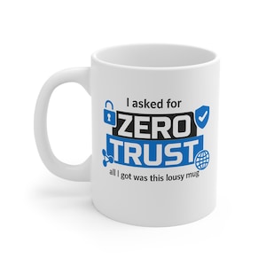 May include: White ceramic mug with a black handle. The mug features the text "I asked for ZERO TRUST all I got was this lousy mug" in blue and black, along with security-themed icons.