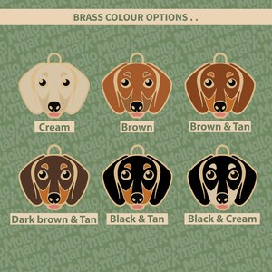 May include: A graphic featuring six dachshund dog head designs in various color combinations, including cream, brown, and black with tan accents. The text "BRASS COLOUR OPTIONS" is at the top, with color names below each dog.