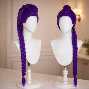 May include: Two purple wigs displayed on white mannequin heads. One wig features a braided style, while the other has a bun with a long braid. The wigs are a vibrant shade of purple, showcasing a cosplay or costume theme.
