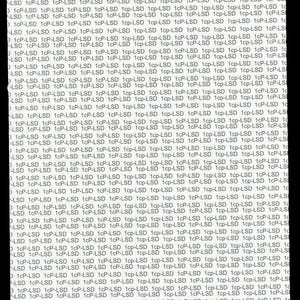 "1cP-LSD" on a blank white Blotter paper with black background. The text is in a sans-serif font and is repeated in rows and columns, creating a dense, all-over design.