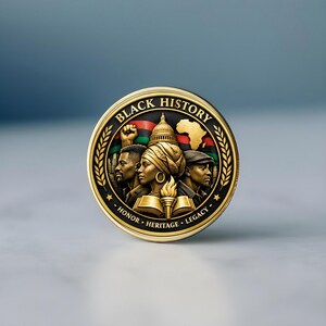 Detailed view of laser engraved Black History coin with smooth edges and polished gold look on dark background