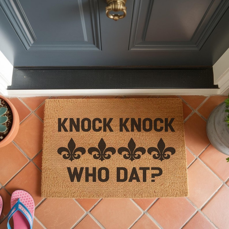 Natural coir doormat with black printed fleur de lis graphics