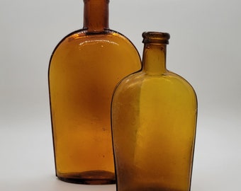 Lot of Two Late 19th Century Cork Top Antique Amber Whiskey Flasks