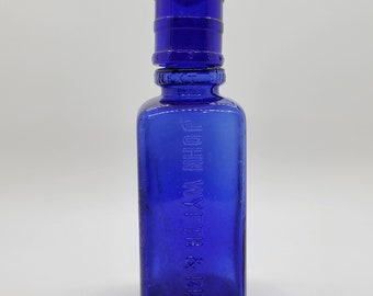 Antique Cobalt Blue Glass Bottle with Separate Dose Cap on the Neck John Wyeth Bro.