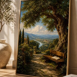 May include: A framed landscape painting depicting a stone path leading through a lush garden with a wooden bench and an open book under a large tree, overlooking a river valley with distant hills, buildings, and a bright blue sky with clouds.
