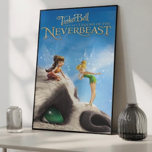 May include: A framed movie poster for "Tinker Bell and the Legend of the NeverBeast." The poster features Tinker Bell and another fairy on a furry creature's head. The background is a blue sky with sparkling effects.