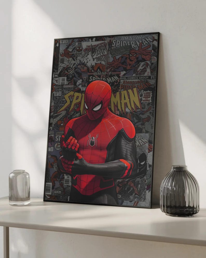 May include: A framed Spider-Man poster. The artwork features Spider-Man in a red and black suit, set against a backdrop of comic book panels. The poster is displayed on a white shelf, with a clear glass vase and a dark gray vase.