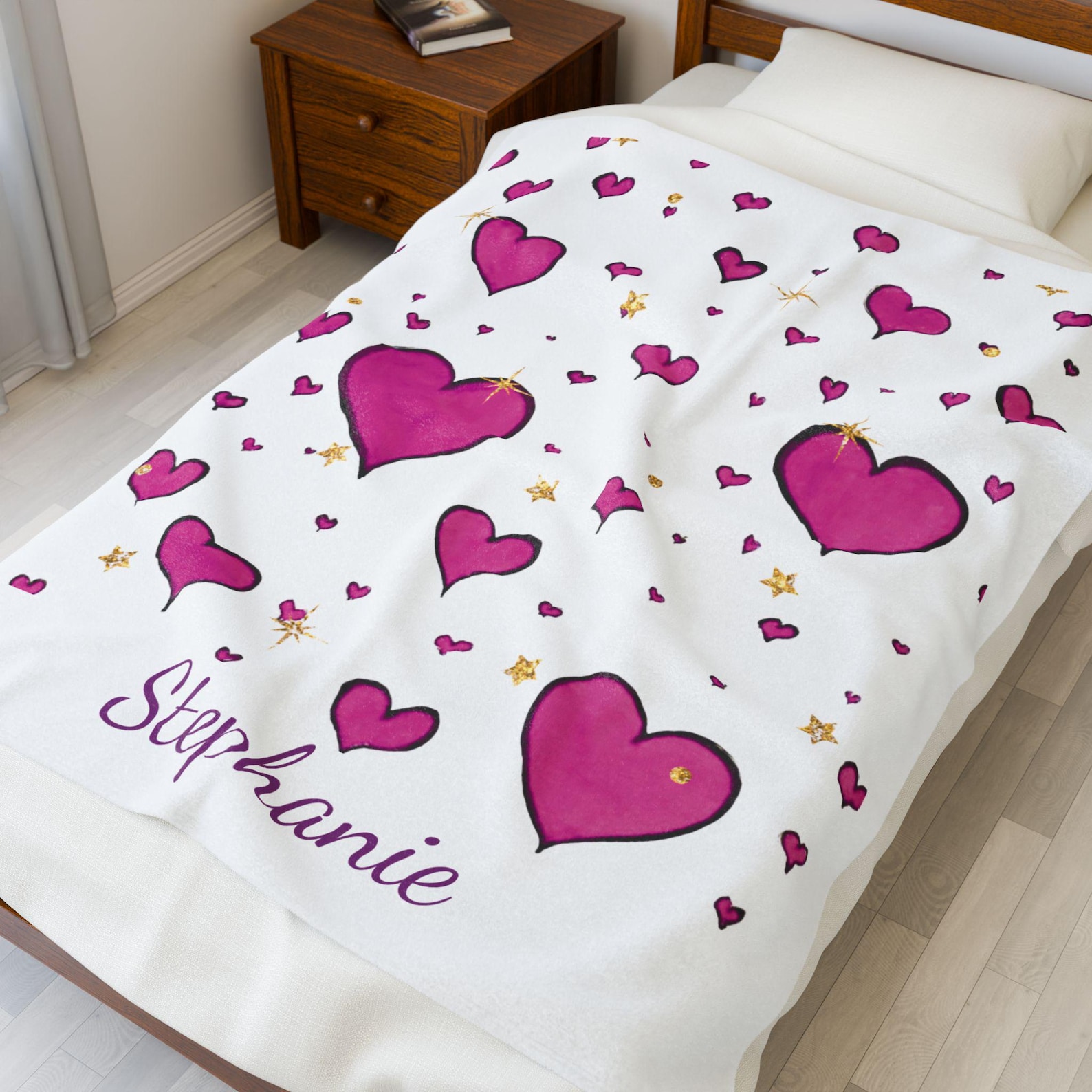 The personalized pink heart blanket shown as a gift