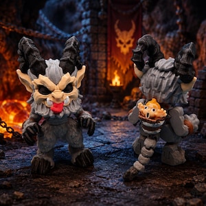 May include: Two fantasy figurines of horned creatures with gray fur, black horns, and menacing expressions. One figure has its tongue sticking out. The background features a dungeon setting with a skull and a banner.